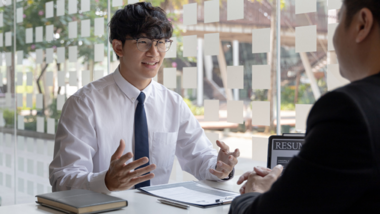 A person giving Programming Fundamentals Question Answer in white shirt and tie